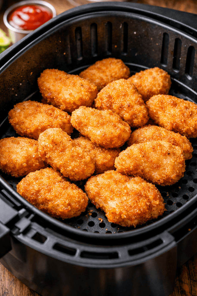Golden crispy Chicken Nuggets in an Air Fryer made with simple ingredients for a healthier snack option